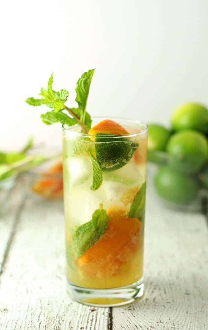 Orange mojitos are the perfect refreshing summer drink! Keep all the ingredients on hand so you can make them all summer long! #cocktail | honeyandbirch.com