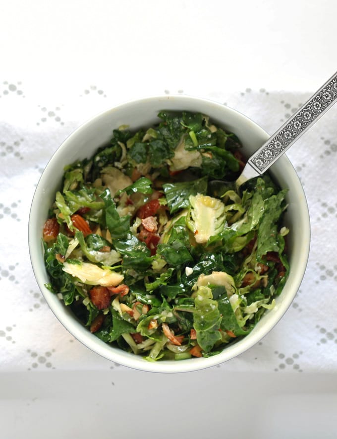 Brussels sprouts kale salad with bacon, almonds, blue cheese and a lemon garlic vinaigrette. Lunch is served! | honeyandbirch.com