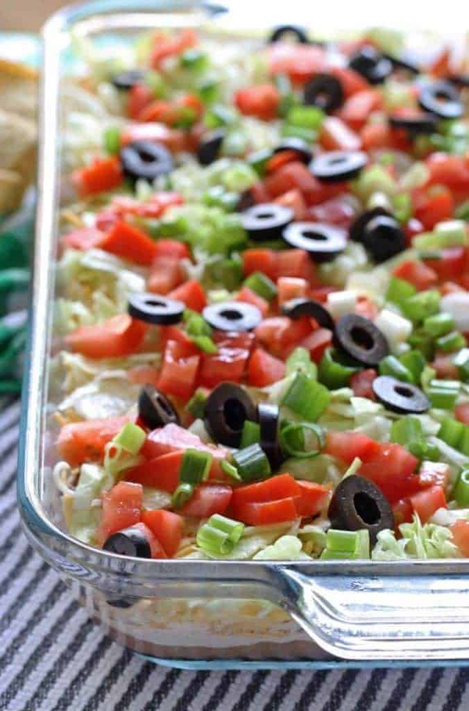 Easy Layered Taco Dip Recipe with Ground Beef » The Thirsty Feast by