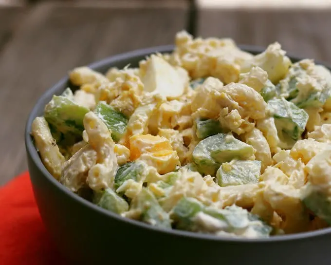 close up photo of boiled egg tuna macaroni salad