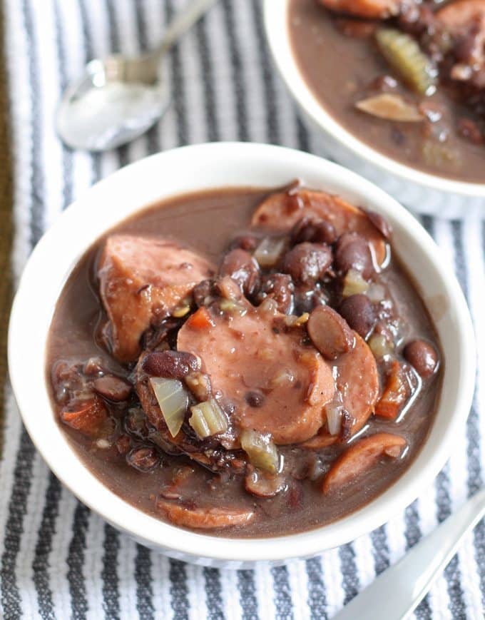 A delicious and easy recipe for slow cooker black bean turkey sausage stew. It requires very little prep but packs a lot of flavor into every bite! | honeyandbirch.com