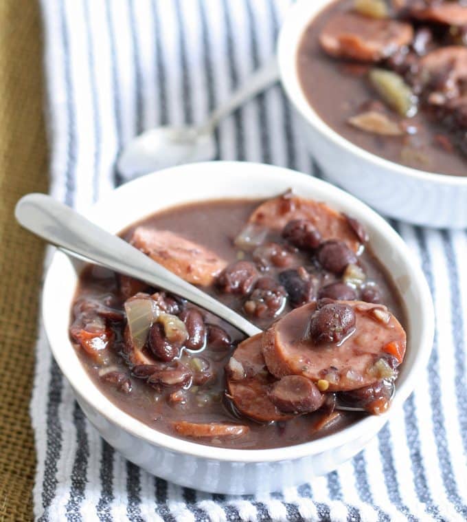 A delicious and easy recipe for slow cooker black bean turkey sausage stew. It requires very little prep but packs a lot of flavor into every bite! | honeyandbirch.com