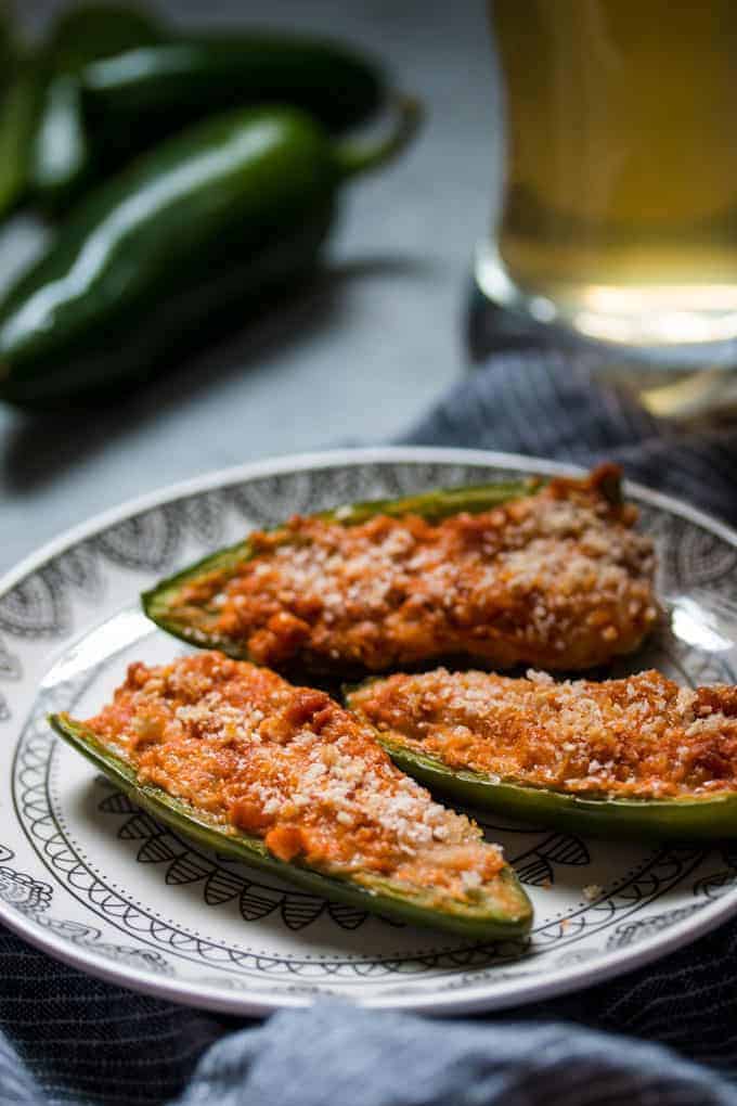 baked jalapeno poppers with a glass of beer