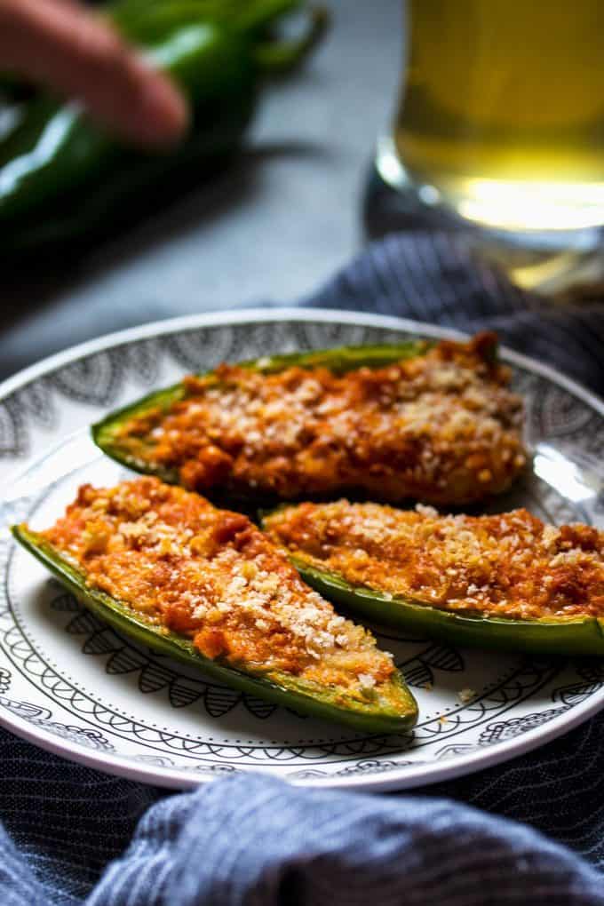 photo of baked jalapeno poppers and a glass of beer