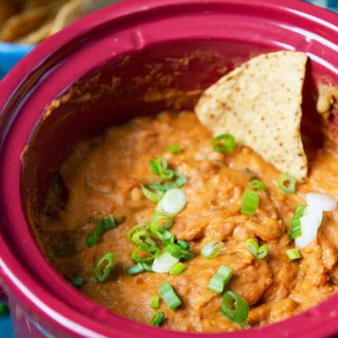 slow cooker bean dip with a chip