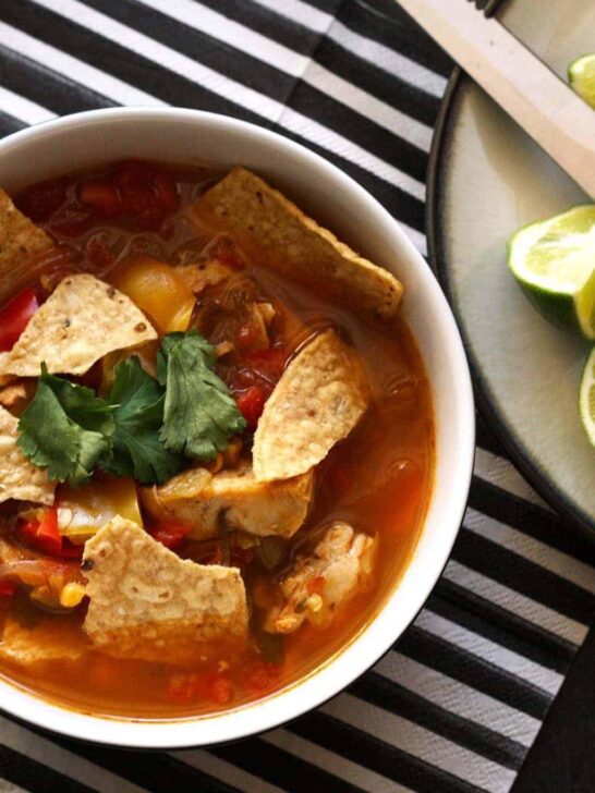 This chicken tortilla soup is easy to make thanks to pre-cooked chicken - you can even use a rotisserie chicken.  It is full of vegetables and spice!