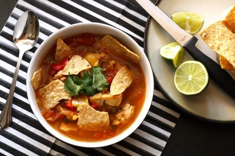 This chicken tortilla soup is easy to make thanks to pre-cooked chicken - you can even use a rotisserie chicken. It is full of vegetables and spice!