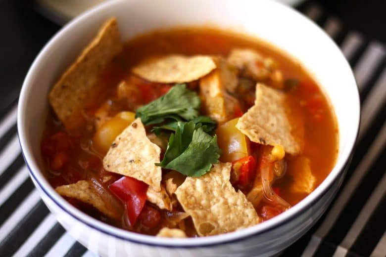 This chicken tortilla soup is easy to make thanks to pre-cooked chicken - you can even use a rotisserie chicken.  It is full of vegetables and spice!