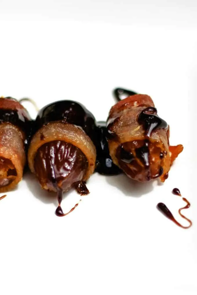 2 bacon wrapped dates with balsamic reduction