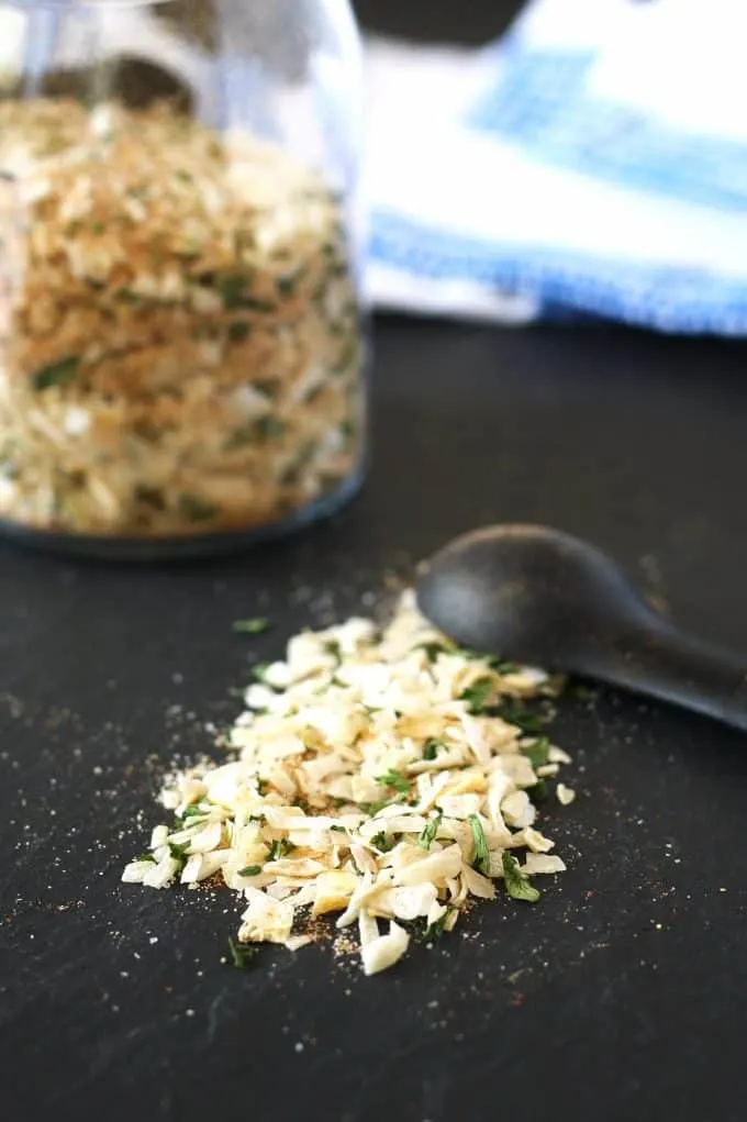 onion soup mix on a black board with a teaspoon