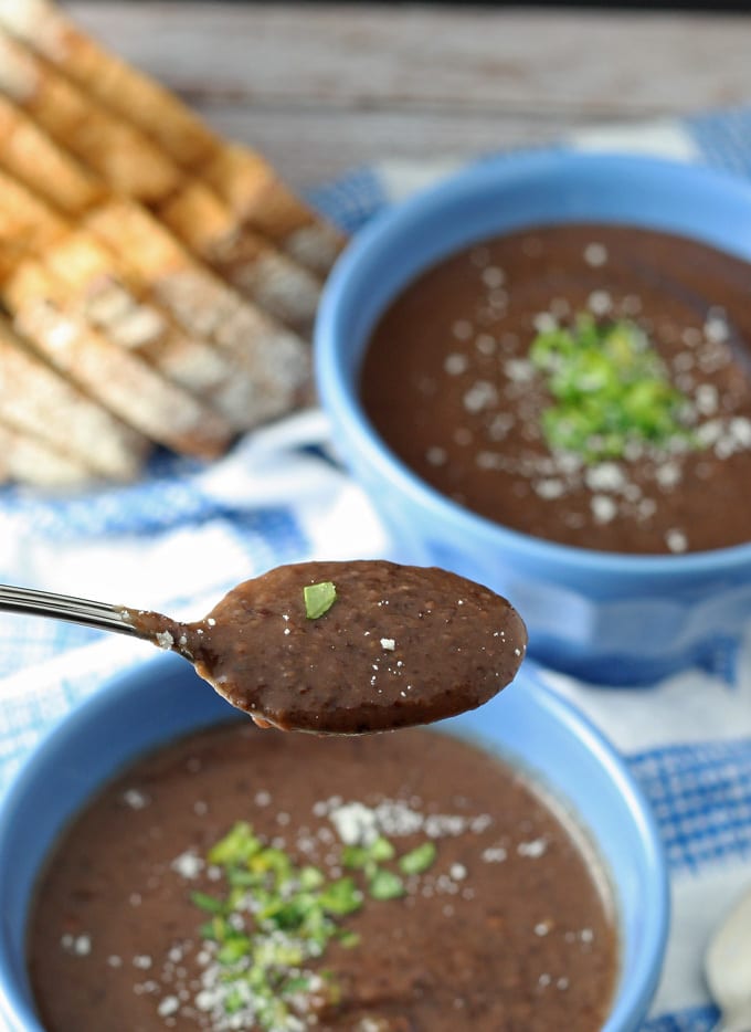 black bean soup on a spoon