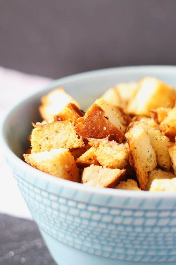 homemade croutons in a blue bowl