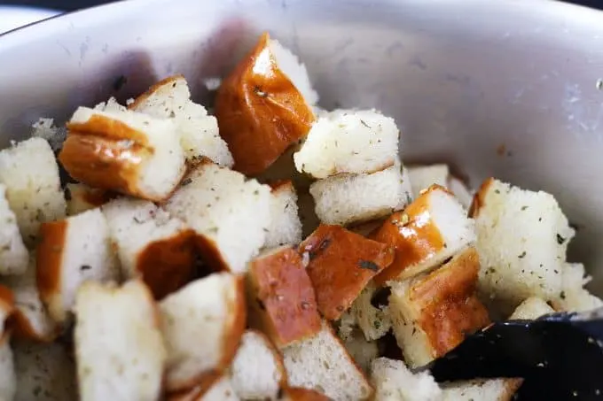 pretzel buns cut into chunks and tossed with olive oil and spices