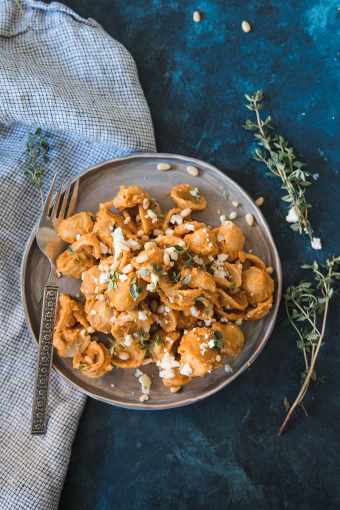 pasta with pumpkin sauce on a gray plate