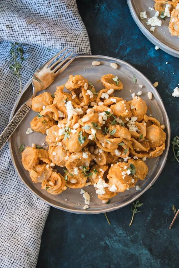 blue napkin and pasta with pumpkin sauce