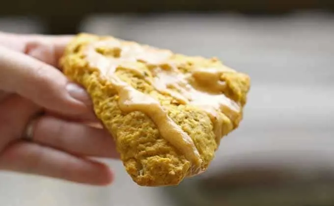 Pumpkin spice scones being held