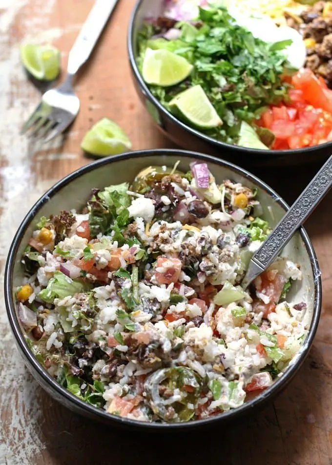 This recipe for loaded burrito bowls will hit the spot if you have picky eaters or need to eat dinner quick. Load the table with a variety of burrito fillings to make this everyone's favorite! | www.honeyandbirch.com