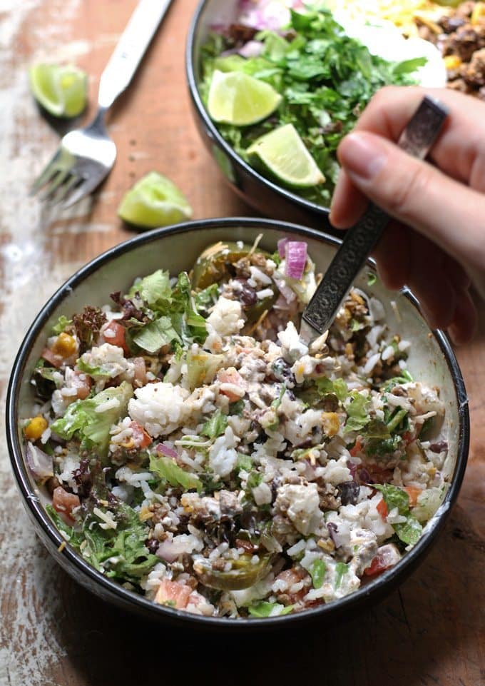 This recipe for loaded burrito bowls will hit the spot if you have picky eaters or need to eat dinner quick. Load the table with a variety of burrito fillings to make this everyone's favorite! | www.honeyandbirch.com