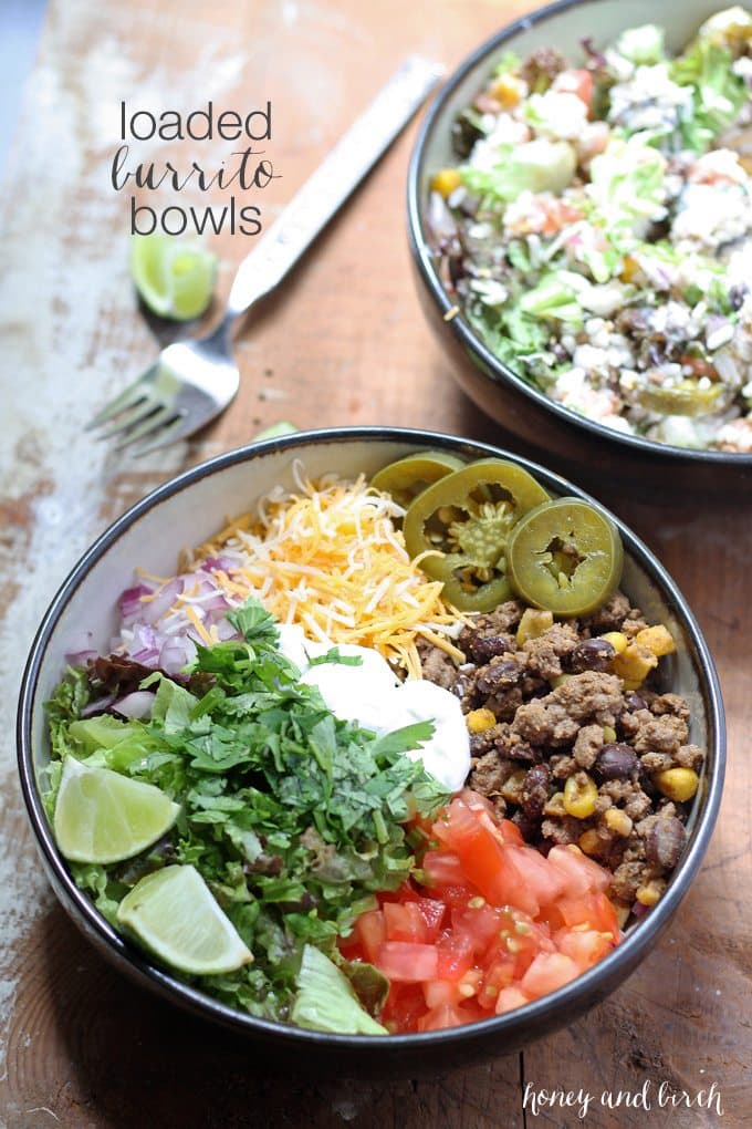 This recipe for loaded burrito bowls will hit the spot if you have picky eaters or need to eat dinner quick. Load the table with a variety of burrito fillings to make this everyone's favorite! | www.honeyandbirch.com