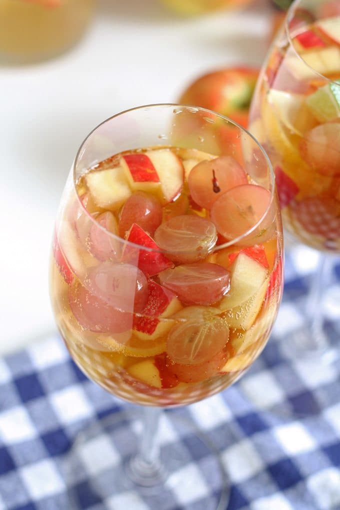 White wine apple cider sangria is the perfect addition to fall brunches. Grab your ingredients and try this recipe today! | honeyandbirch.com