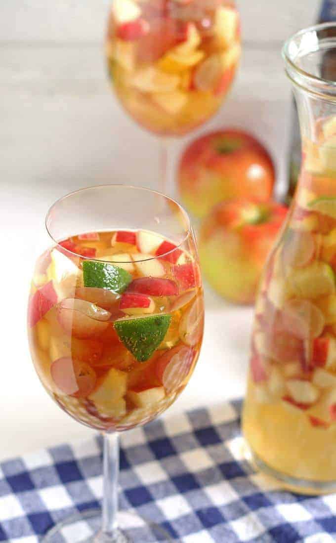 White wine apple cider sangria is the perfect addition to fall brunches. Grab your ingredients and try this recipe today! | honeyandbirch.com