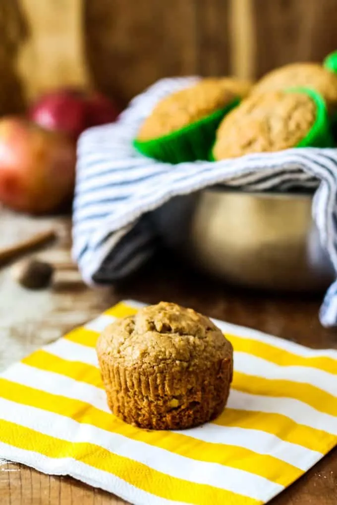 one spiced apple muffin on a yellow napkin