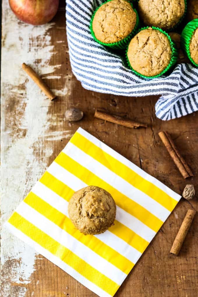 spiced apple muffin and a basket of apple muffins