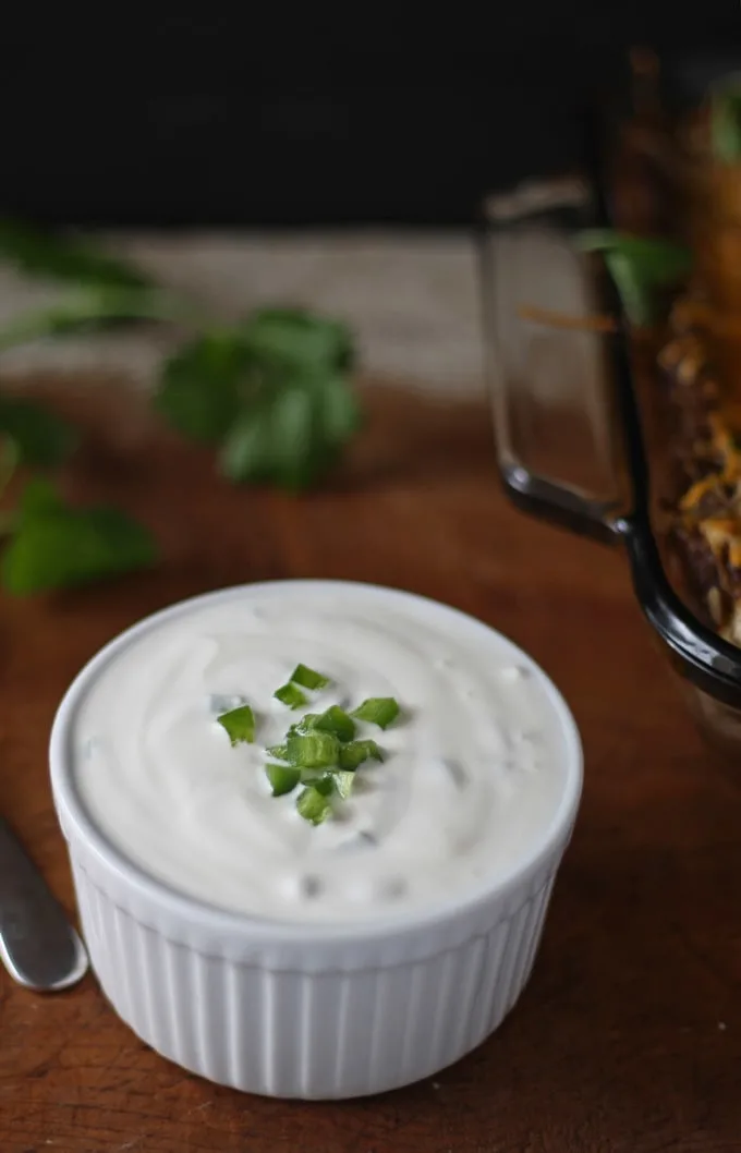 Black Bean Enchiladas with Jalapeno Crema | www.honeyandbirch.com #mexican