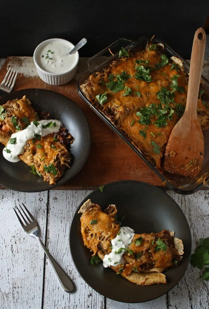 Black Bean Enchiladas with Jalapeno Crema | www.honeyandbirch.com #mexican