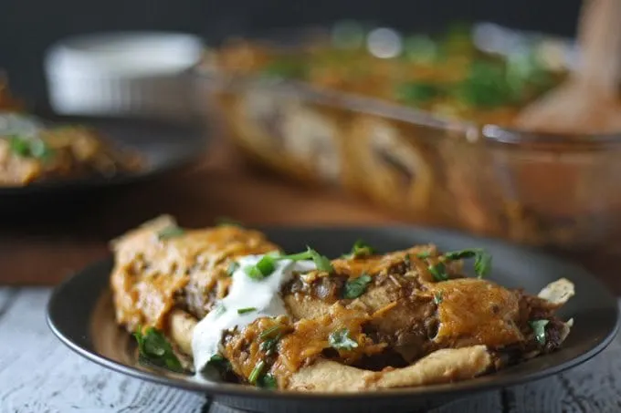 Black Bean Enchiladas with Jalapeno Crema | www.honeyandbirch.com #mexican