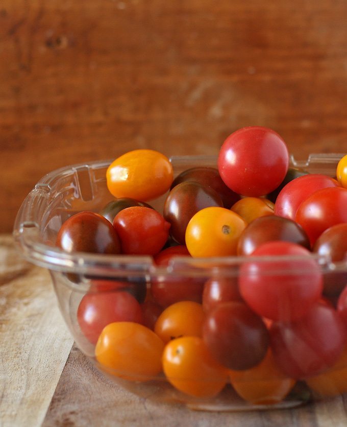 Easy roasted cherry tomatoes and garlic - perfect as a side dish or on top of pasta! | www.honeyandbirch.com