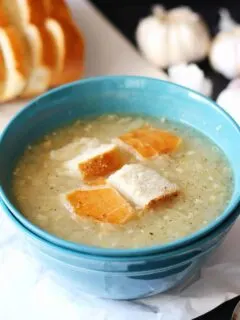 garlic soup in a blue bowl
