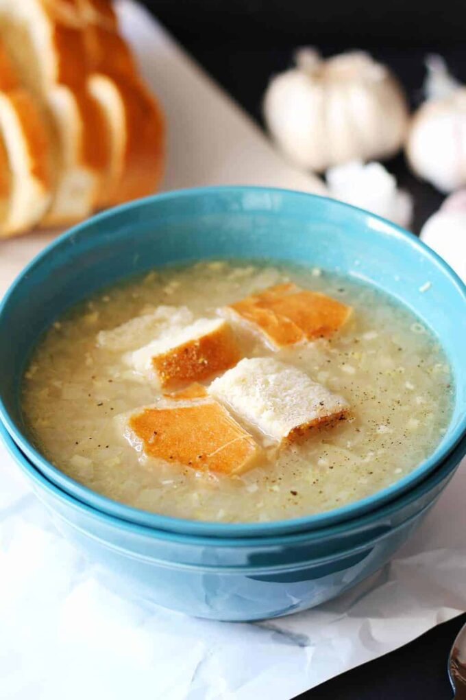 garlic soup in a blue bowl