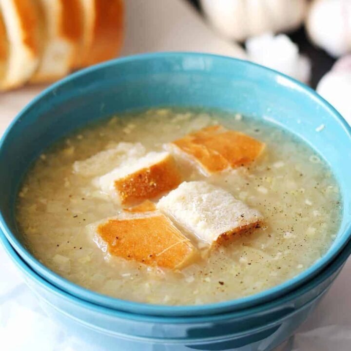 garlic soup in a blue bowl