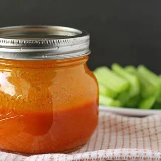 Homemade Buffalo Sauce | Don't buy store bought sauce, make your own! Perfect for chicken wings. www.honeyandbirch.com #condiment #sauce