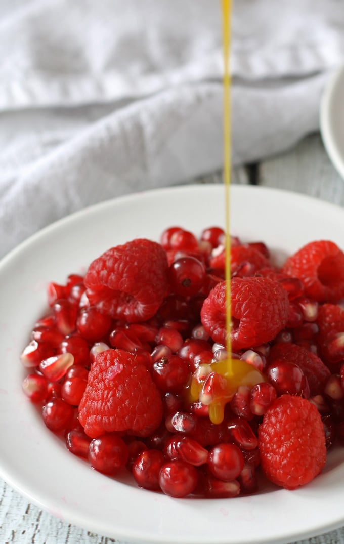 Red Fruit Salad | Sweet and tart, full of raspberries, pomegranate and red currant! www.honeyandbirch.com #fruit #salad