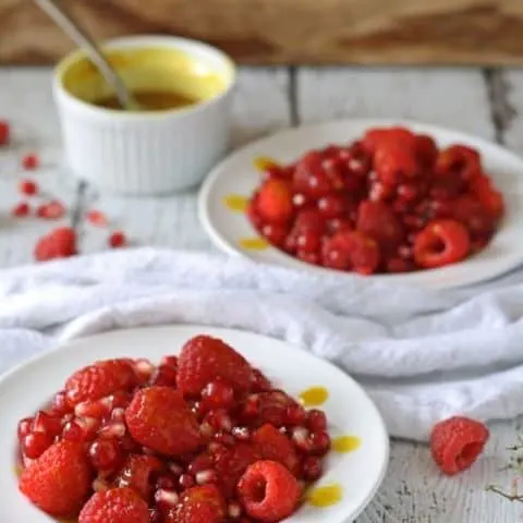 Red Fruit Salad | Sweet and tart, full of raspberries, pomegranate and red currant! www.honeyandbirch.com #fruit #salad