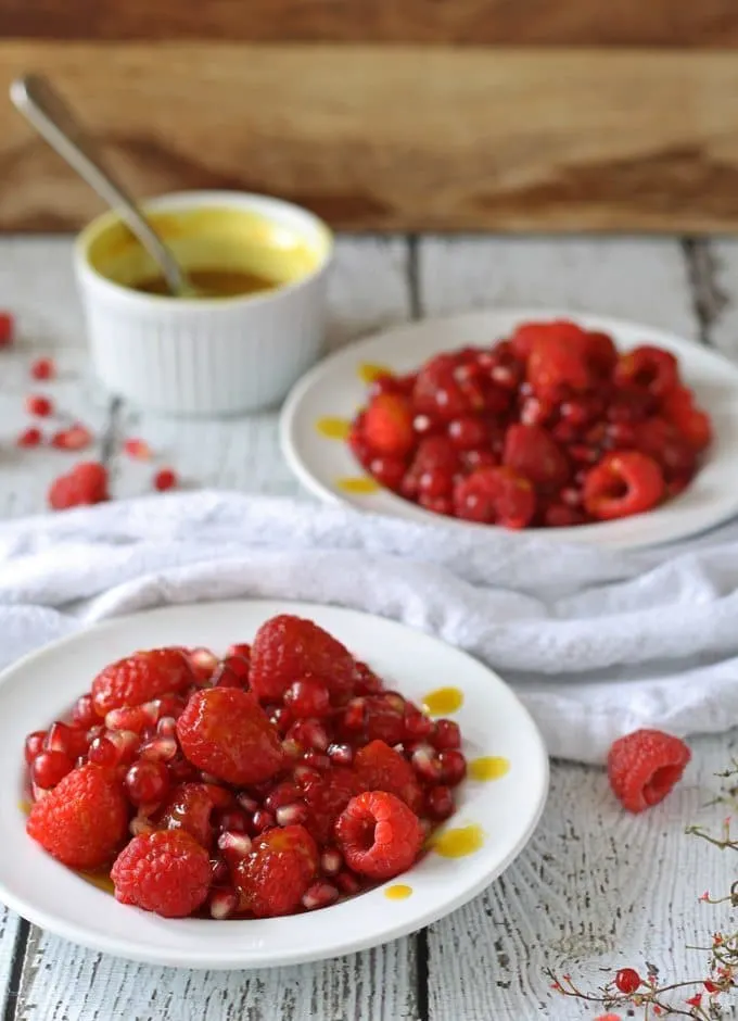 Red Fruit Salad | Sweet and tart, full of raspberries, pomegranate and red currant! www.honeyandbirch.com #fruit #salad