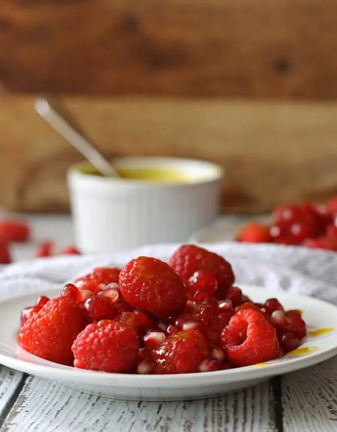 Red Fruit Salad | Sweet and tart, full of raspberries, pomegranate and red currant! www.honeyandbirch.com #fruit #salad