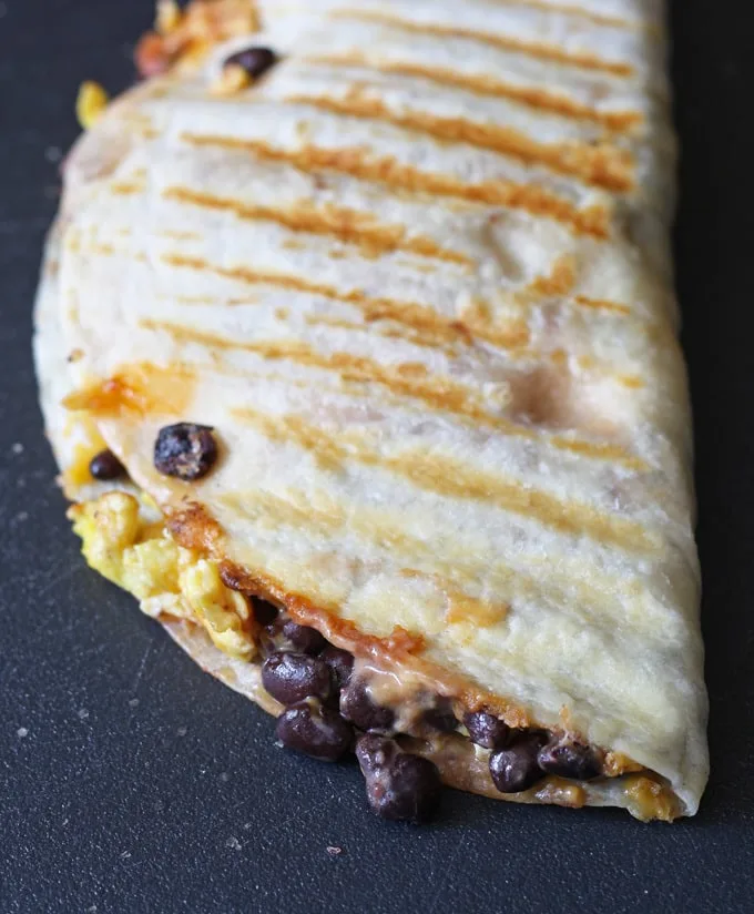 This easy breakfast quesadilla is a great way to start your day - full of eggs, black beans and cheese! Only 10 minutes to cook. | www.honeyandbirch.com