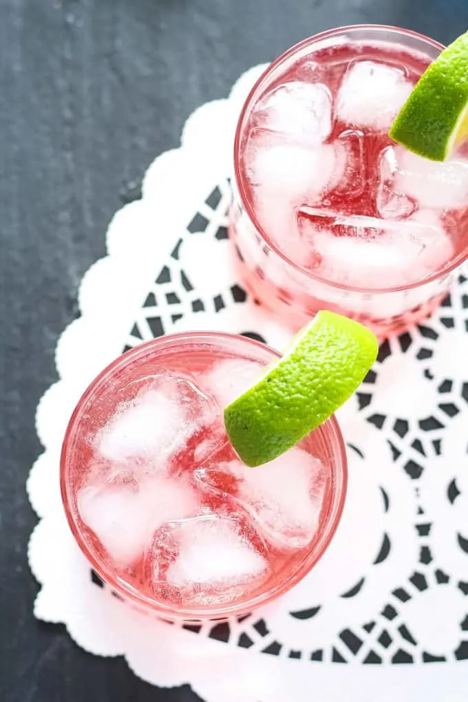 overhead photo of two raspberry gin spritzers