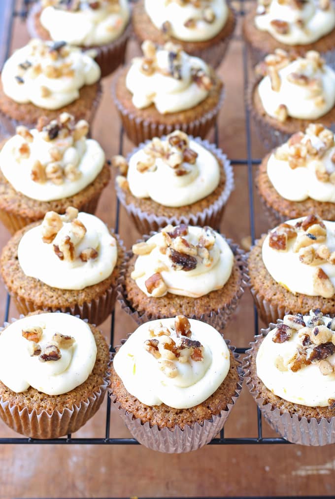 Delicious carrot cake cupcakes, filled and topped with sweet cream cheese frosting! | honeyandbirch.com
