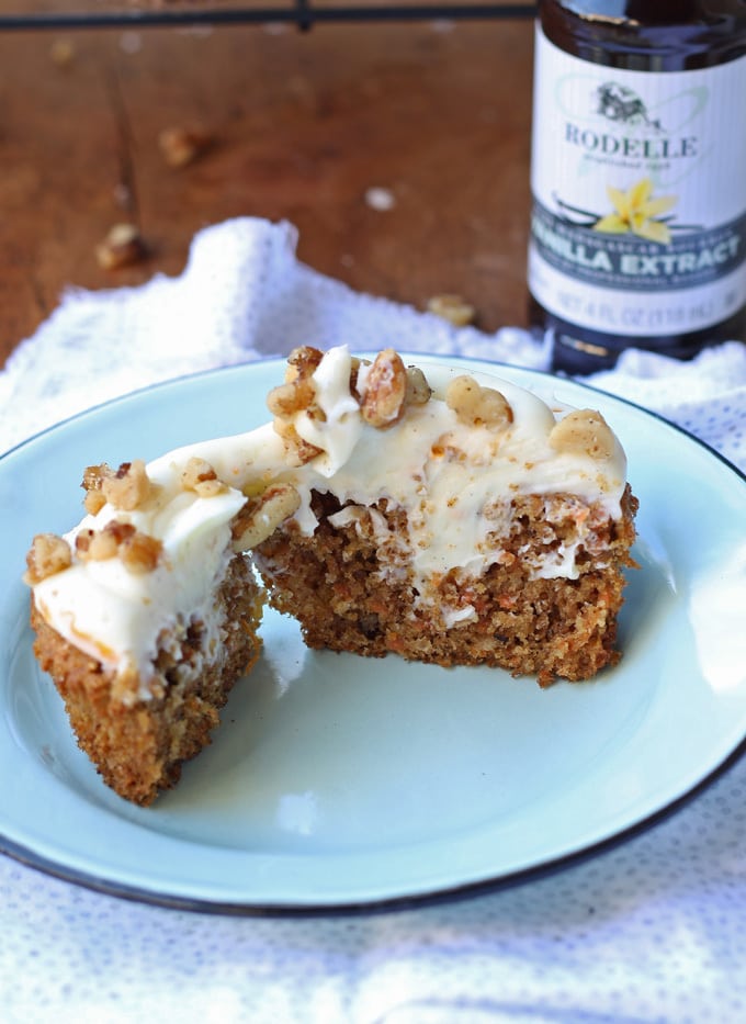 Delicious carrot cake cupcakes, filled and topped with sweet cream cheese frosting! | honeyandbirch.com