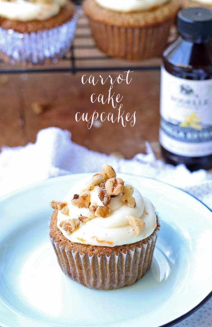 Delicious carrot cake cupcakes, filled and topped with sweet cream cheese frosting! | honeyandbirch.com