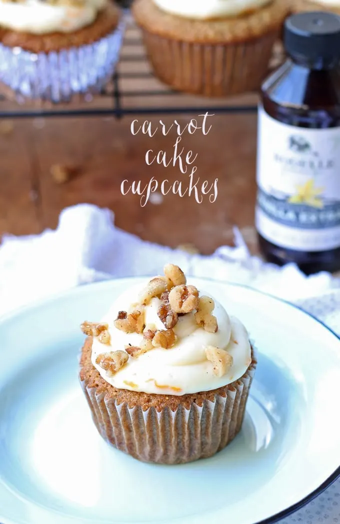Delicious carrot cake cupcakes, filled and topped with sweet cream cheese frosting! | honeyandbirch.com