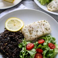 easy baked alaskan halibut with wild rice and a small salad