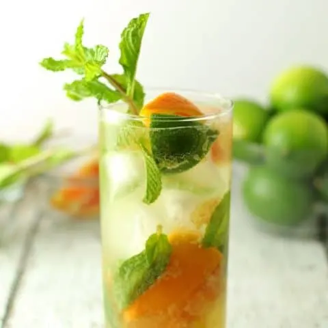 Orange mojitos are the perfect refreshing summer drink! Keep all the ingredients on hand so you can make them all summer long! #cocktail | honeyandbirch.com
