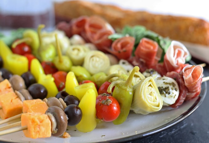 Easy finger food recipe to prepare appetizers on a stick with simple and tasty ingredients such as spicy salami, boiled eggs, stuffed olives, and learn in this video how to make appetizers on a stick by using a yummy and easy cold appetizer recipe for parties with egg and salami! Finger Food Cold Appetizers On A Stick : Antipasto Skewers Recipe Easy Italian Appetizers With Video