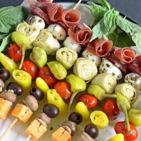 These antipasto skewers are the perfect lazy day appetizer. They can easily be made from store bought pickled items or from your pantry stash! | honeyandbirch.com