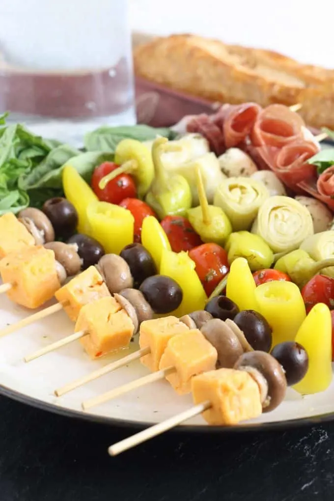 antipasto skewers with loaf of bread